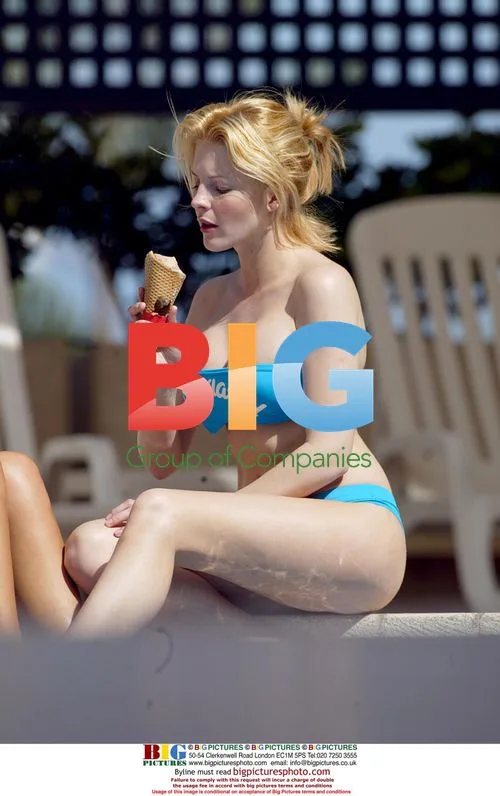 Glamour Models Michelle Marsh and Jo Hicks Relaxing by Pool