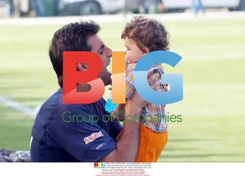 Ricardo Signs Autographs with Son