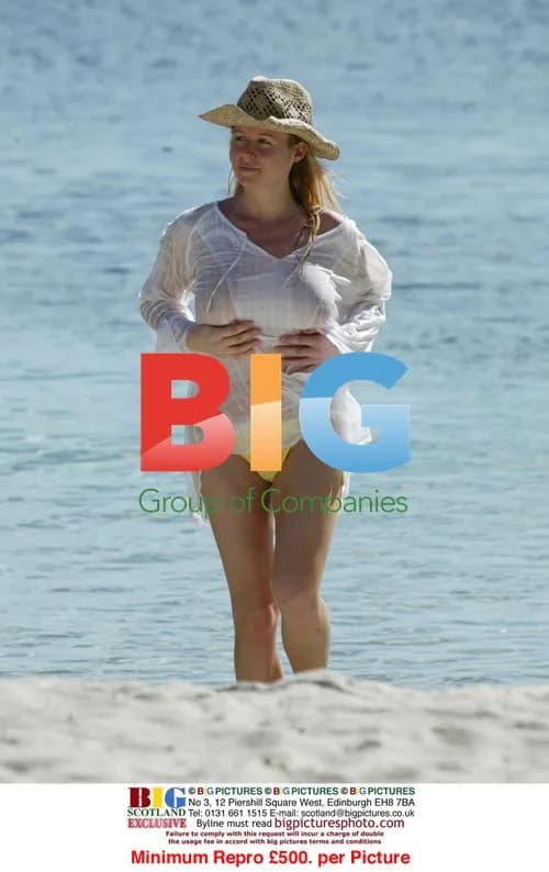 Abi Titmuss Doing Yoga on Beach