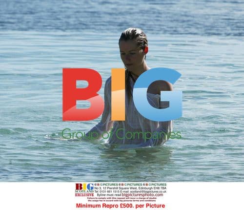 Abi Titmuss Practices Yoga on Beach