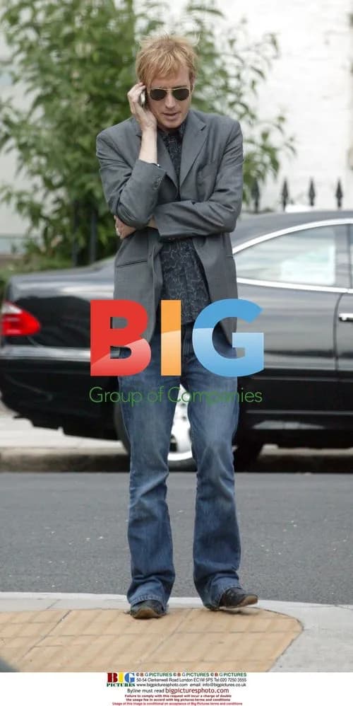 Rhys Ifans on Mobile Phone in London