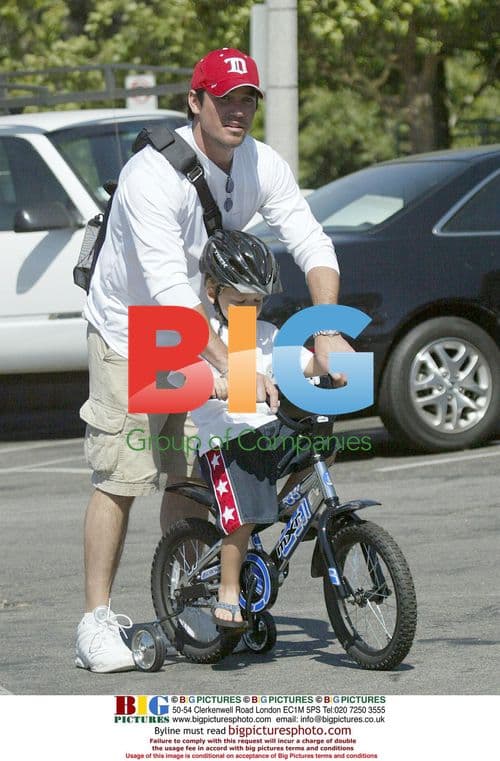 Dean Cain buys son Christopher a new bike