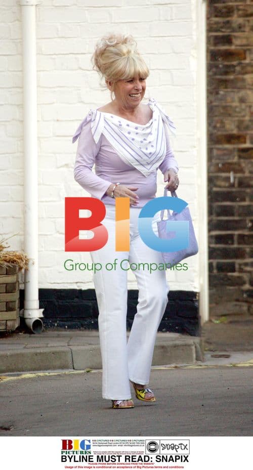 Barbara Windsor Catching Taxi in London