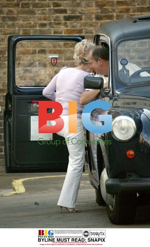 Barbara Windsor catching taxi in London