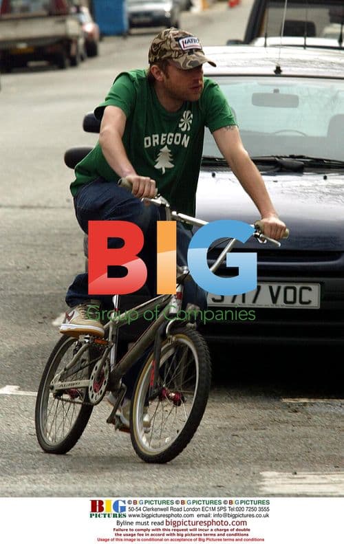 Damon Albarn Bikes Through Notting Hill