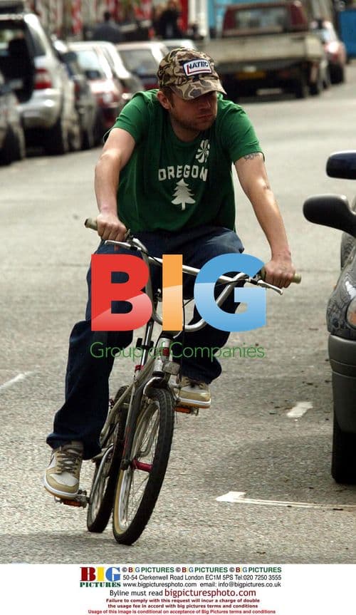 Damon Albarn Cycles Through Notting Hill