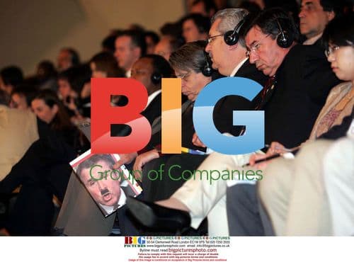 Audience Member with Anti-Bush Publication