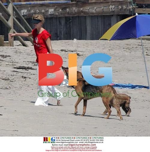Charlize Theron with Dogs at Beach House