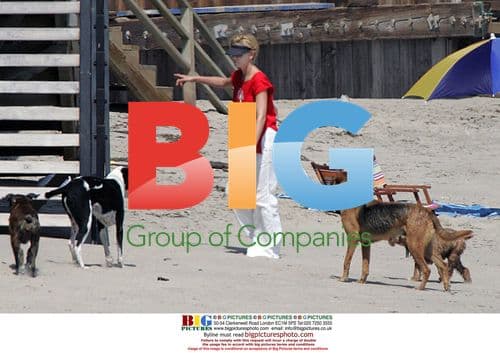 Charlize Theron with Dogs at Beach