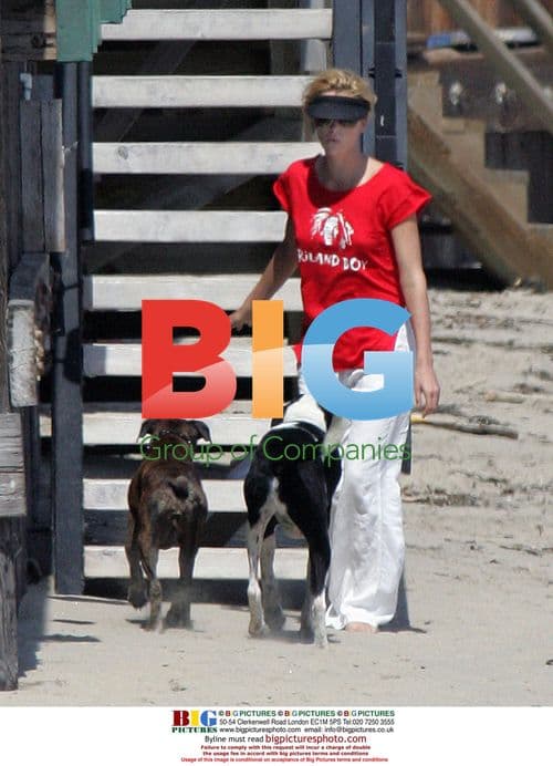 Charlize Theron with Dogs at Beach House