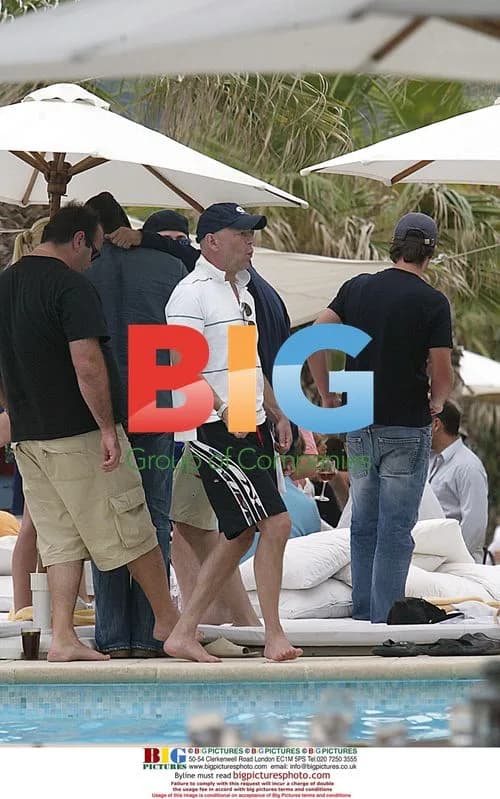 Bruce Willis plays air guitar in St. Tropez