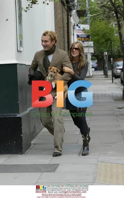 Jude Law and Sienna Miller out with puppies