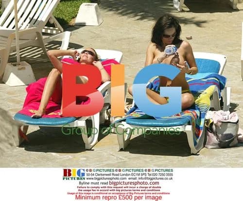 Page 3 models tanning by pool in Tenerife