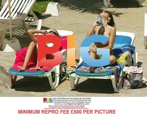 Page 3 models tanning by pool in Tenerife