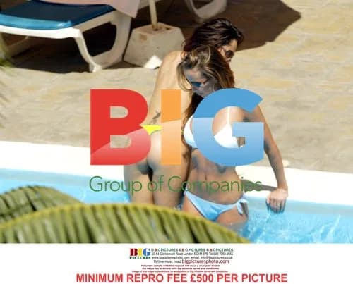 Page 3 models tanning by pool in Tenerife