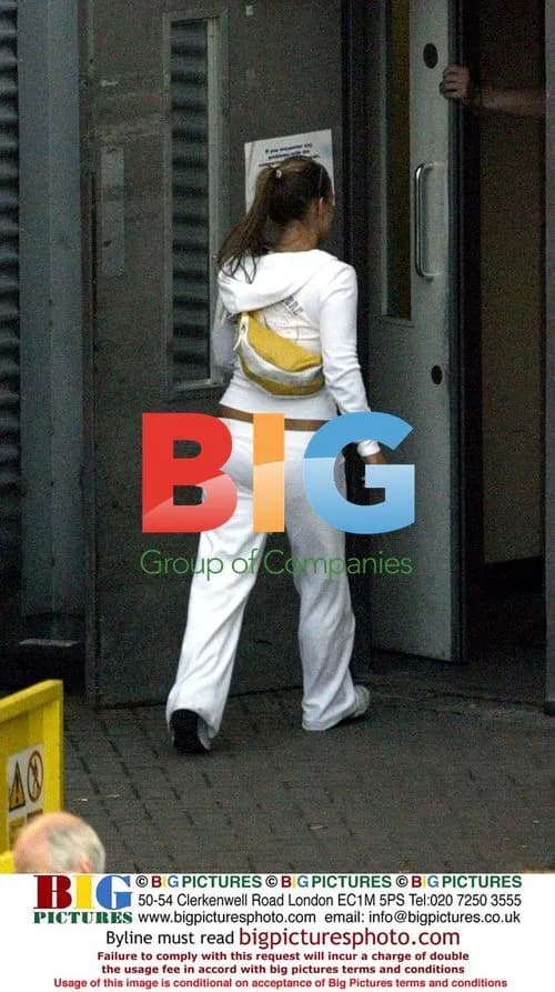 Coleen McLoughlin Carries Bags at Manchester Airport