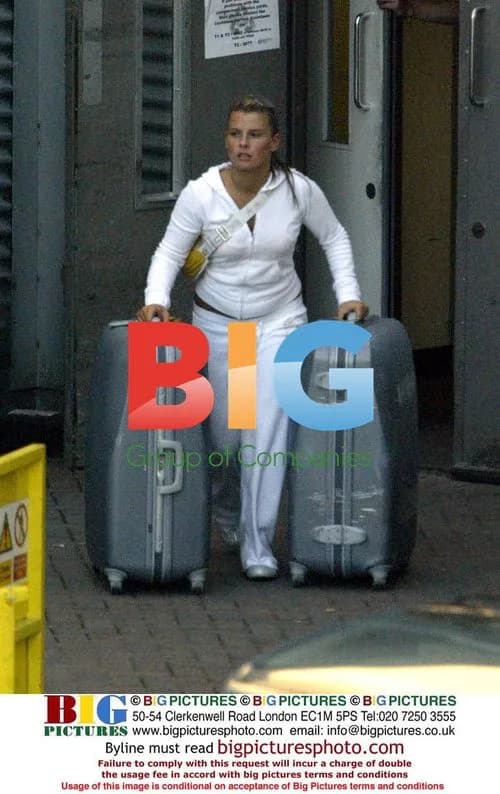 Coleen McLoughlin Carrying Luggage at Manchester Airport
