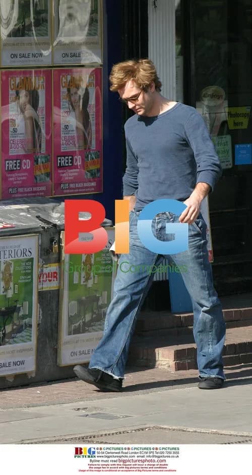 Jude Law Picks Up Newspaper