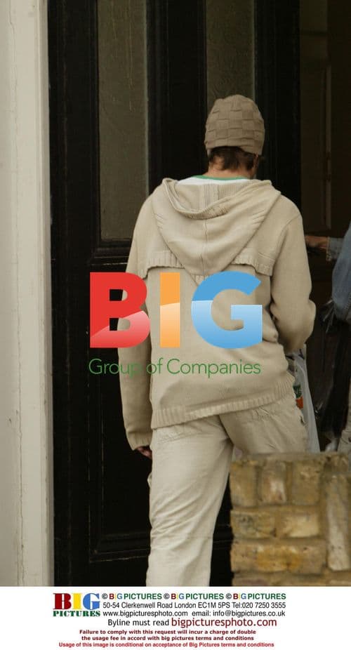 Lucy Benjamin and Boyfriend Entering Flat