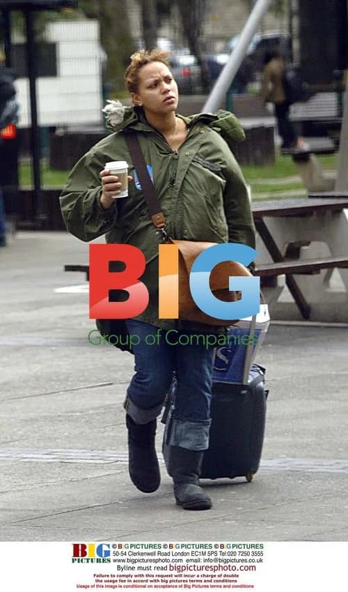 Pregnant Angela Griffin Kissing Boyfriend at Euston Station