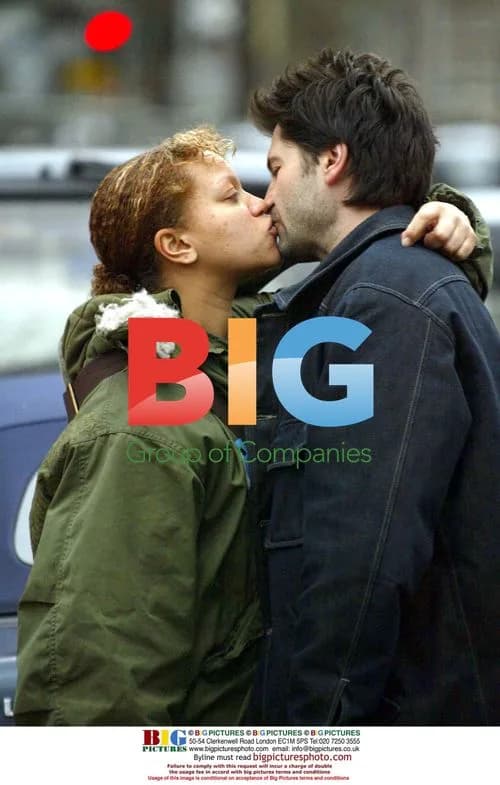 Pregnant Angela Griffin and boyfriend kiss at Euston Station