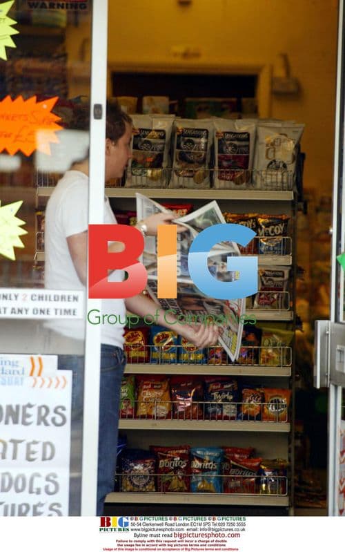 Joe Swash Shows Off Newspaper Photo