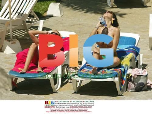 Models Tanning by Pool in Tenerife