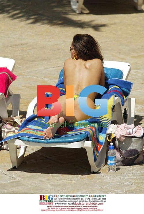 Models Tanning by Pool in Tenerife