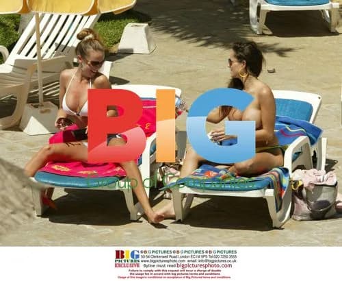 Page 3 models tanning by pool in Tenerife