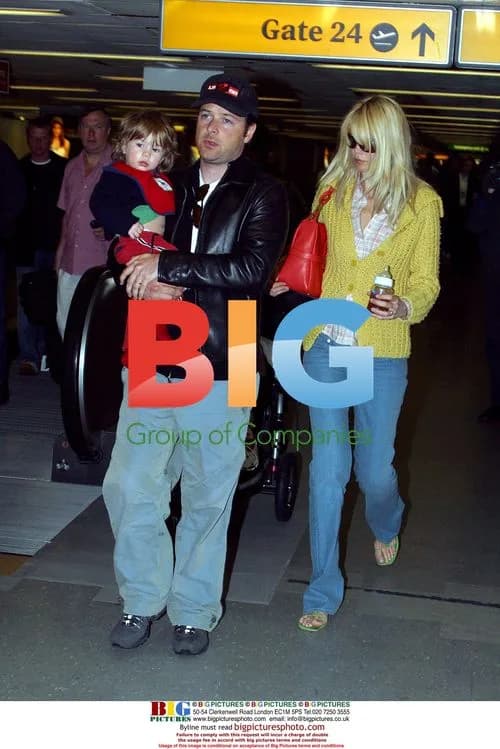 Matthew Vaughan, Claudia Schiffer and son Caspar at Heathrow