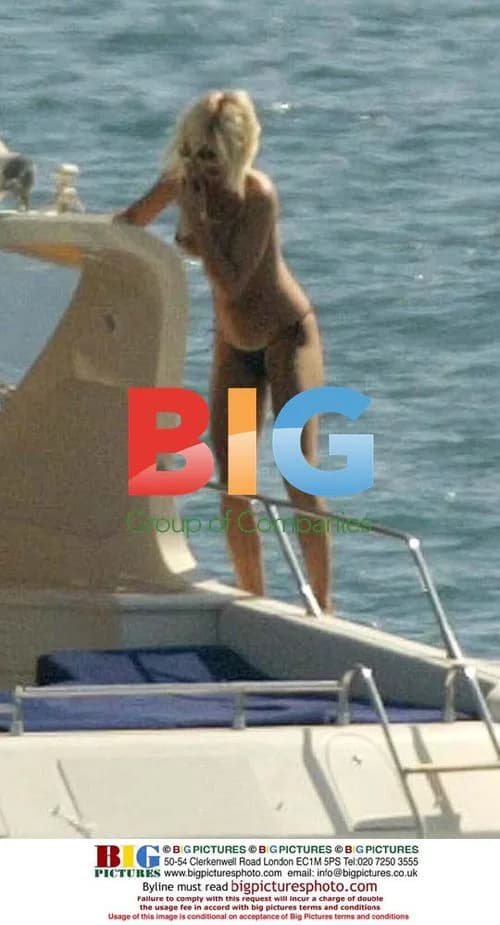 Model Victoria Silvstedt Sunbathing on Boat