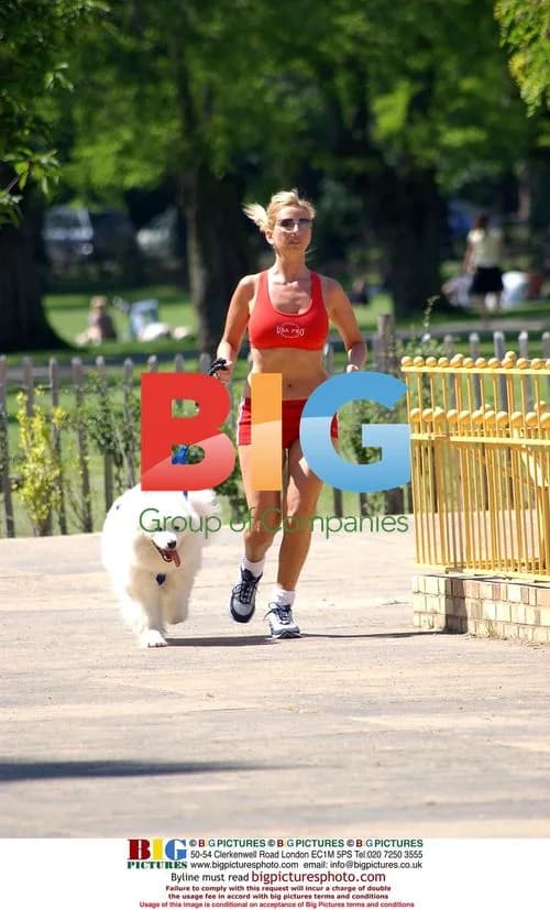 Anneka Svenska enjoys sunny day with dog in Battersea Park