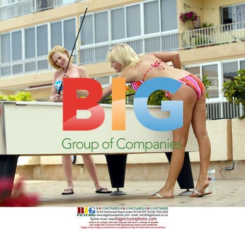 Glamour models Michelle Marsh and Jo Hicks playing snooker