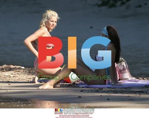 Glamour models Jerri and Jo play on the beach