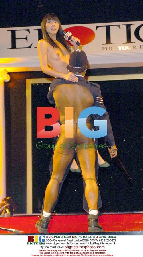 Snakes and Scantily Clad Attendees at Erotica Expo