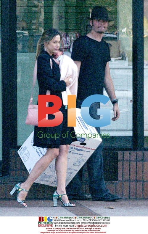 Mira Sorvino and Chris Backus with Newborn