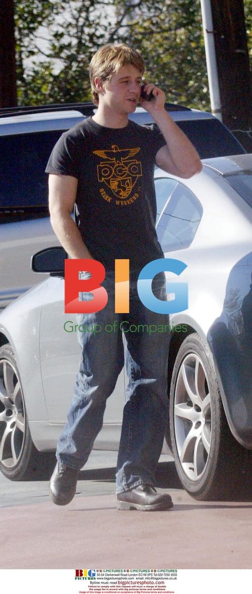 Benjamin Mackenzie pumping gas in LA