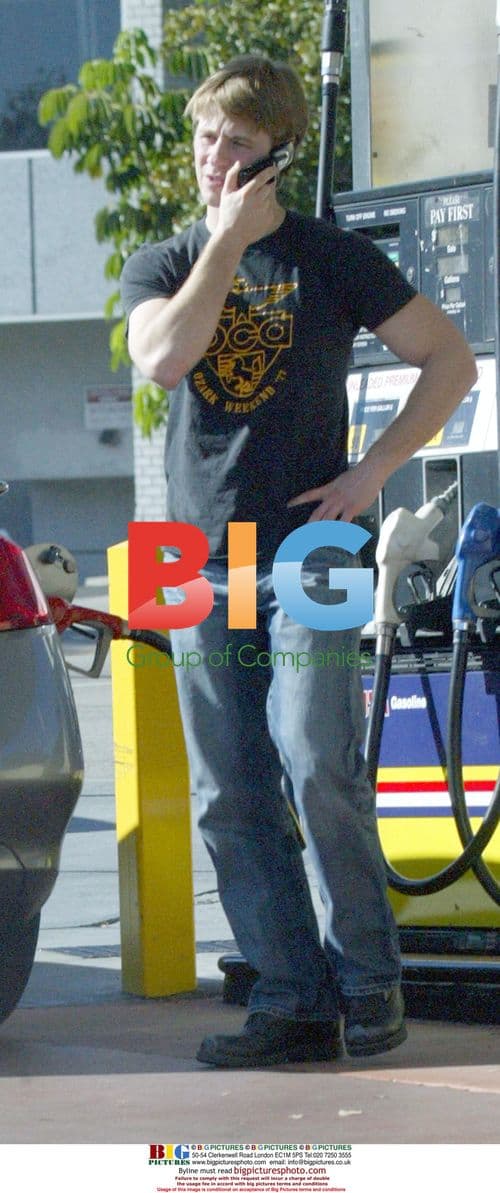 Benjamin Mackenzie pumping gas in LA