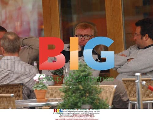 Chris Evans Looking Glum with Friends in London