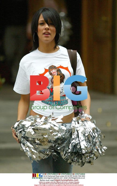 Emma Davis Leaving Hotel for Cheerleading Role