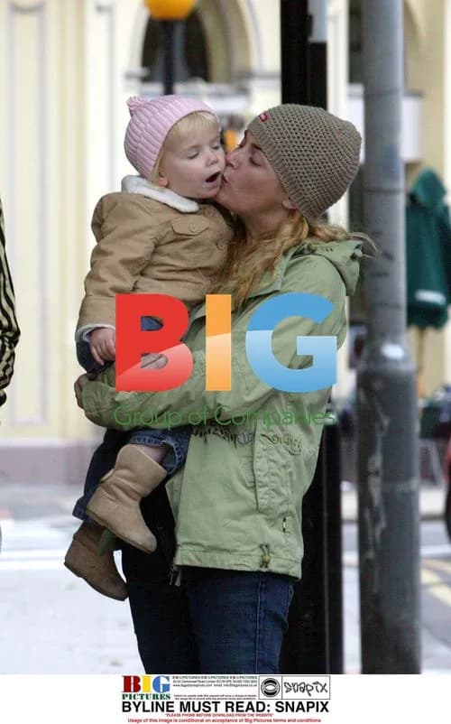 Gail Porter-Hipgrave and family stroll in North London