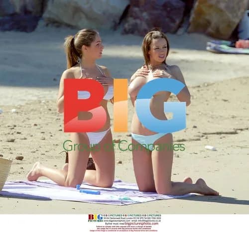 Glamour Models Lucy Pinder and Sophie Howard on Beach