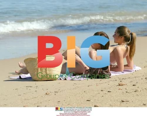 Glamour models relaxing on beach