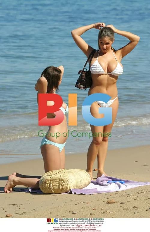 Glamour Models Relaxing on Beach