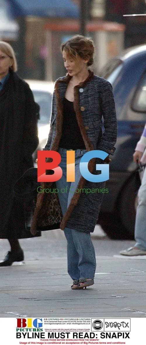 Kylie Minogue Leaves Home in Leopard Coat