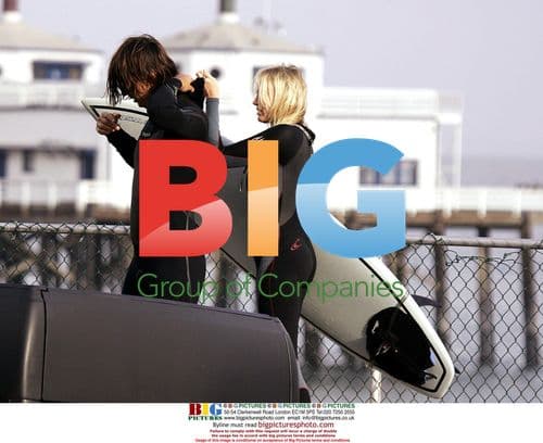 Daryl Hannah and boyfriend surfing in Malibu