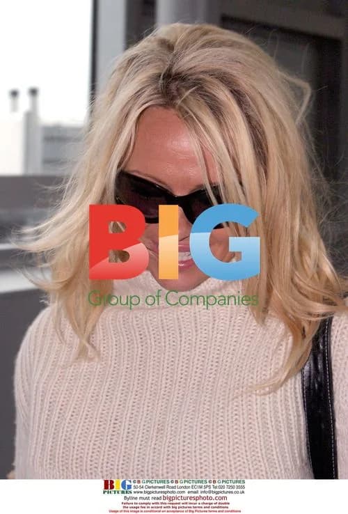 Pamela Anderson at Heathrow Airport