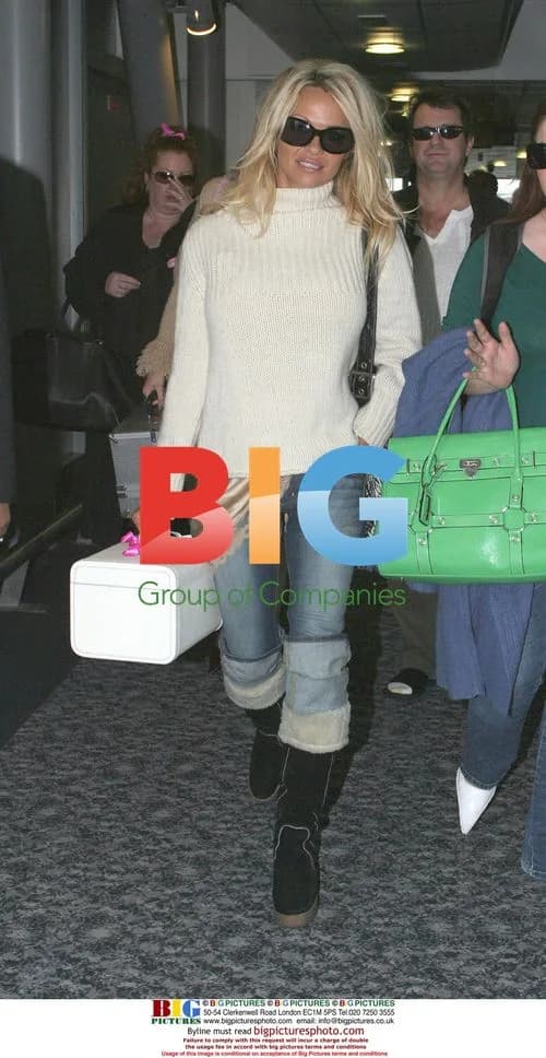 Pamela Anderson Arrives at Heathrow
