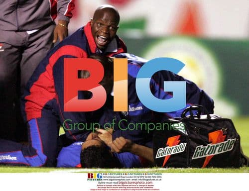 Doctor assisting injured soccer player Serginho