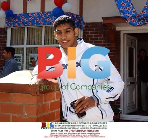 Amir Khan with dad outside home
